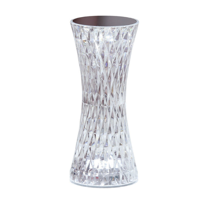 Clear glass vase with textured design on a white background