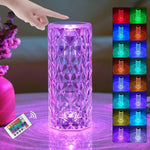 Colorful LED lamp with remote control and light display on a table.