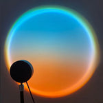 Colorful circular light effect with a black silhouette of a lamp against a dark background