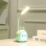 Cute cartoon-style night light on a table with a neutral background