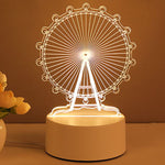 Ferris wheel night light on a brown surface with a warm glow