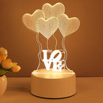 Decorative lamp with heart shapes and 'LOVE' text on a brown background