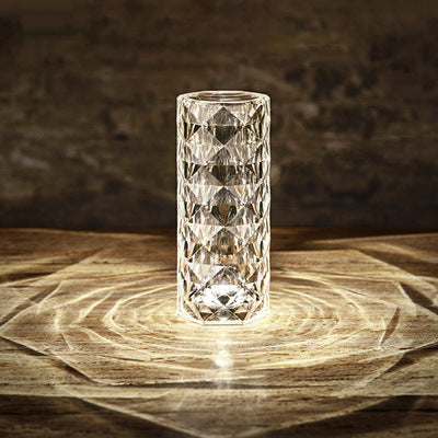 Crystal vase on a wooden surface with a dark background