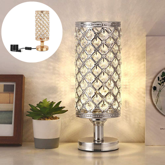 Decorative table lamp with crystal design on a surface, with a close-up inset showing the lamp's base.