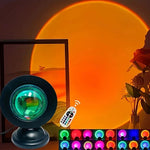 Color-changing lamp with remote control in front of a sunset scene