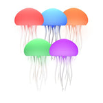 Five colorful jellyfish toys on a white background