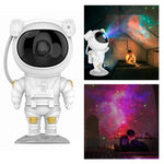 Astronaut-shaped night light projecting a colorful galaxy pattern on a ceiling.