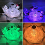 Crystal vase with LED lights showing color-changing effect on a table.