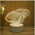 Car-shaped night light on a wooden surface
